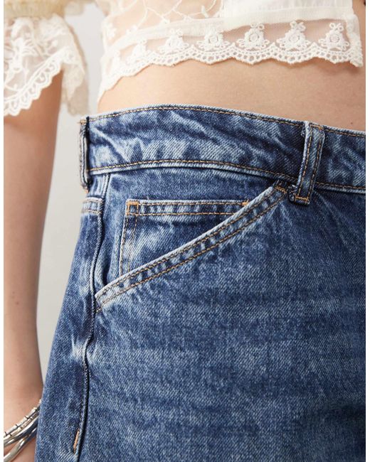 Bermuda baggy en jean à taille basse - moyen délavé Reclaimed (vintage) en coloris Blue