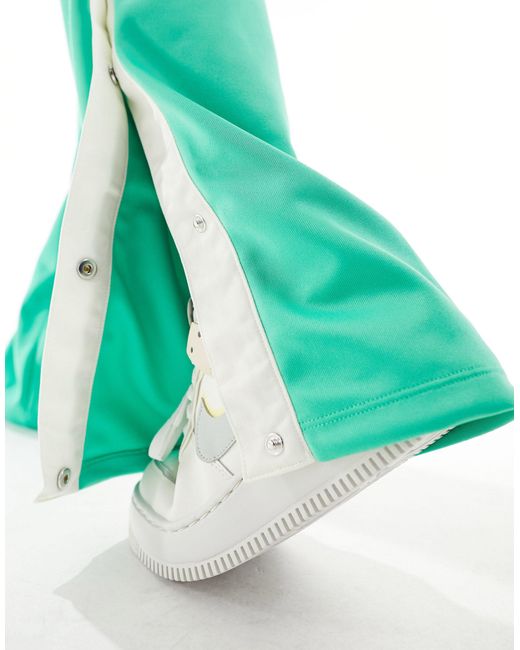 Air - break away - pantalon tissé à taille mi-haute - printemps Nike en coloris Green