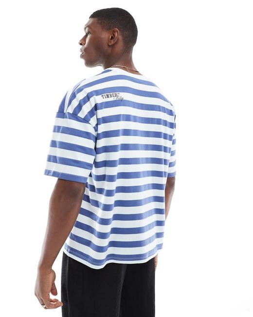 Camiseta A Rayas Azules Y Blancas De Corte Cuadrado Extragrande Con Hombros Caídos Y Estampado En La Espalda De ASOS de hombre de color Blue