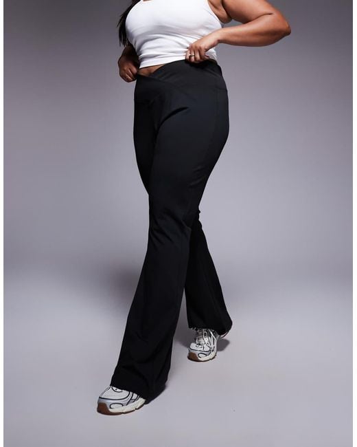 Pantalones De Campana Negros Moldeadores De Talle Alto Con Cinturilla Cruzada De Asos Design Curve ASOS de color Black