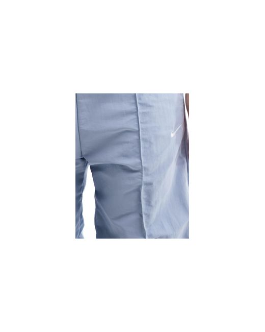 Trend - pantalon parachute baggy - clair Nike en coloris Blue