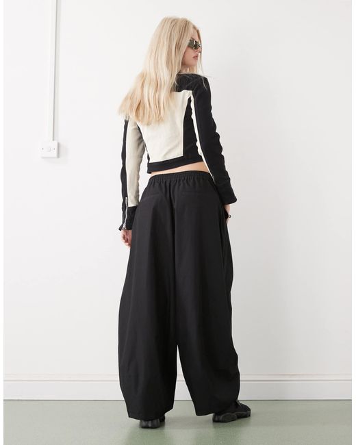 Pantalon ample Collusion en coloris Black