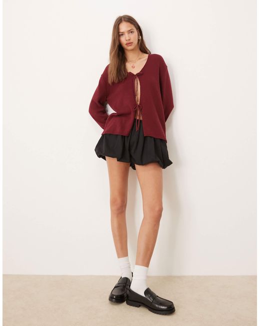 Gilet oversize en maille avec col v et liens noués à l'avant - rouille ASOS en coloris Red