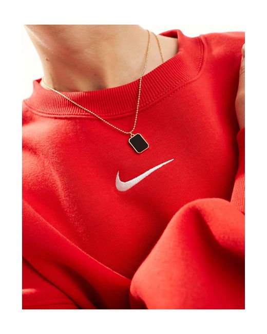 Sweat court unisexe coupe extra oversize en polaire à mini logo virgule Nike en coloris Red