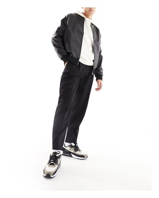 Pantalon habillé oversize fuselé ASOS pour homme en coloris Black