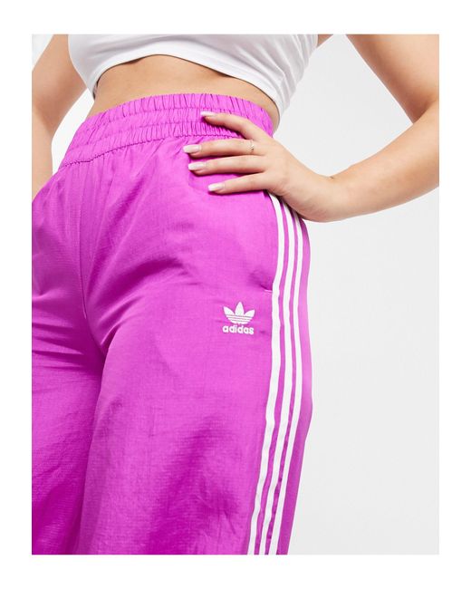 adidas Originals Bellista Three Stripe wide-legged Pants in Pink | Lyst