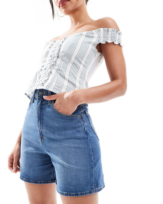 Stella - short en jean à taille haute - moyen Lee Jeans en coloris Blue