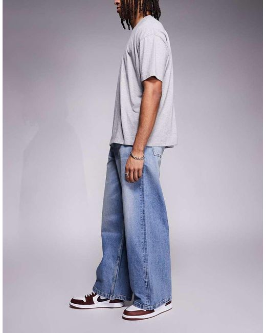 Vaqueros Azules Muy Holgados Con Lavado Claro De ASOS de hombre de color Blue
