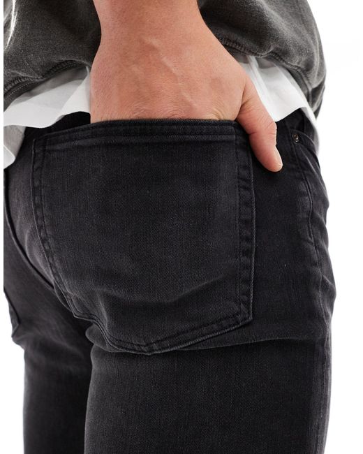 Jeans skinny délavé di ASOS in Gray da Uomo