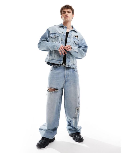 Giacca trucker di jeans lavaggio chiaro con strappi di Collusion in Blue da Uomo