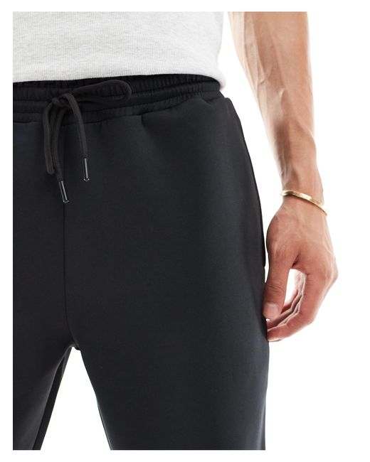 ASOS – eng geschnittene cargo-jogginghose in Black für Herren