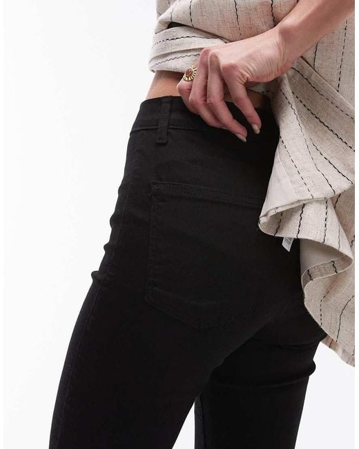 Vaqueros De Corte Superpitillo Y Talle Alto Joni De TOPSHOP de color Black