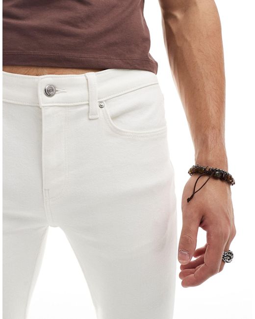 Jeans a zampa elasticizzati écru di ASOS in White da Uomo
