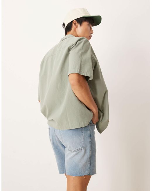 Short en jean mi-long coupe slim à déchirures - clair délavé ASOS pour homme en coloris Blue