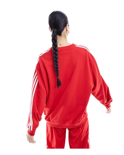 Sweat-shirt à trois bandes Adidas Originals en coloris Red