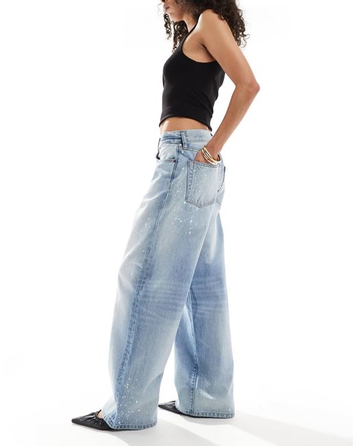 Jean large délavé à imprimé effet éclaboussures Calvin Klein en coloris Blue