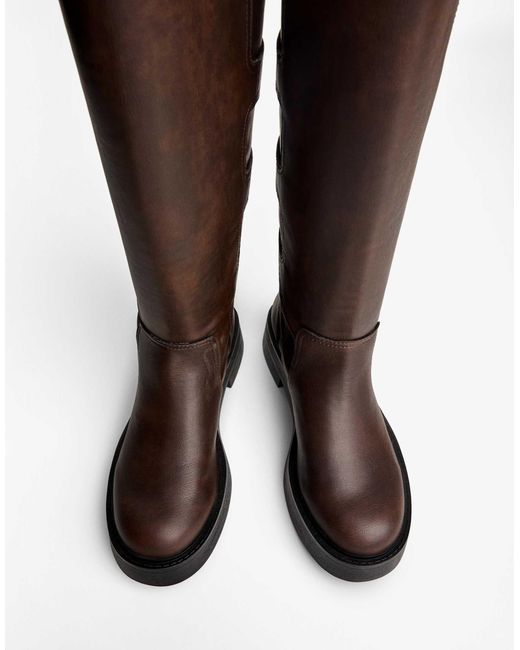 Bottes plates avec boucles Bershka en coloris Brown
