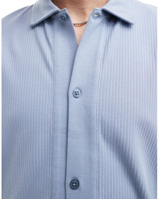 Camicia polo comoda vestibilità comoda con bottoni di ASOS in Blue da Uomo