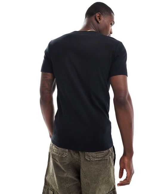 T-shirt attillata a coste nera di ASOS in Black da Uomo