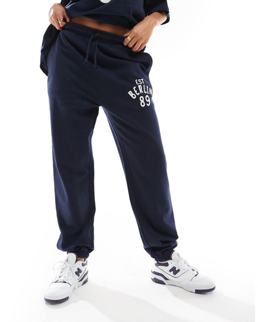 ASOS Blue Oversized Cuffed Trackies With Applique Berlin Graphic