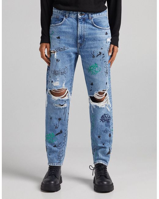 Jean droit déchiré à imprimé graffiti Bershka pour homme en coloris Blue