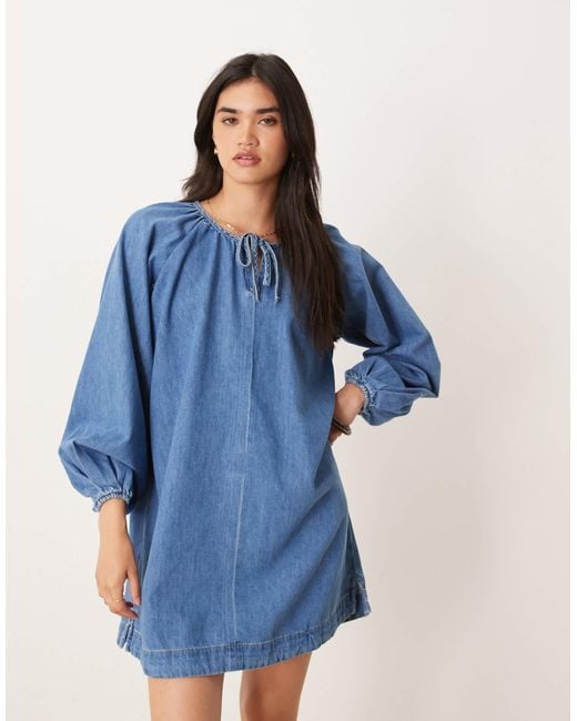 Robe courte en jean avec manches ballon - clair vintage ASOS en coloris Blue