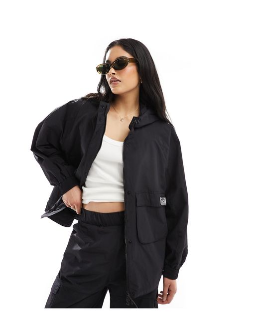 Armani - veste coupe-vent d'ensemble en nylon à capuche et fermeture éclair à logo EA7 en coloris Black