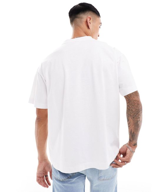 Cotton On Cotton on – lässig und kastig geschnittenes t-shirt mit "happy hour"-textprint und sonnen-grafik in White für Herren