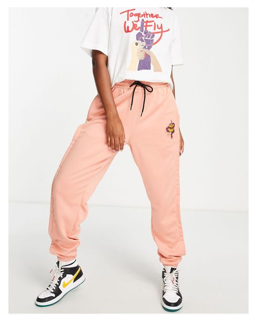 nike polyknit track pants in blue and orange