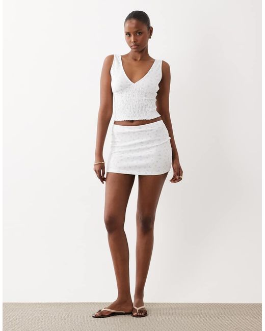 The Frolic White Exclusive Plunge Neck Shirred Waist Top