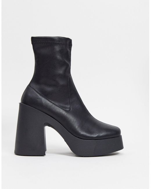 asos design elsie high heeled sock boots in black patent