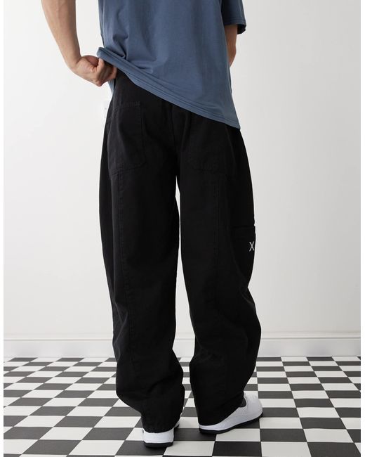 Pantalon bouffant effet raccordé à surpiqûres - délavé Collusion pour homme en coloris White