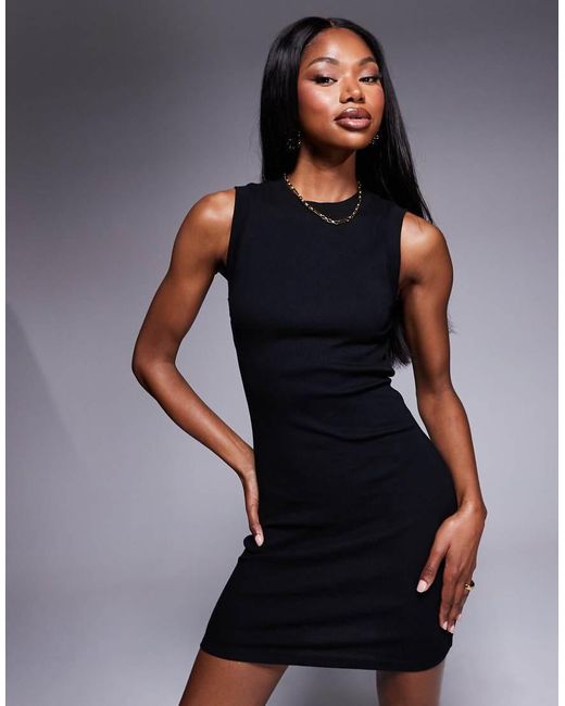 Vestido Corto Estilo Camiseta Sin Mangas Con Diseño Reforzado Años 90 De Canalé De ASOS de color Black