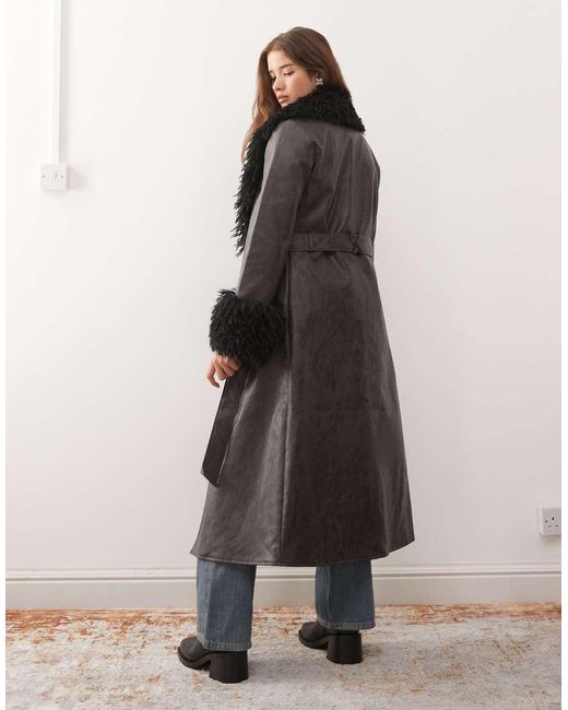 Reclaimed Vintage Black Longline Leather Look Trench Coat With Faux Fur Collar And Cuffs