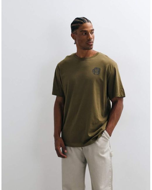 The North Face Green Basecamp Barista Graphic T-Shirt for men