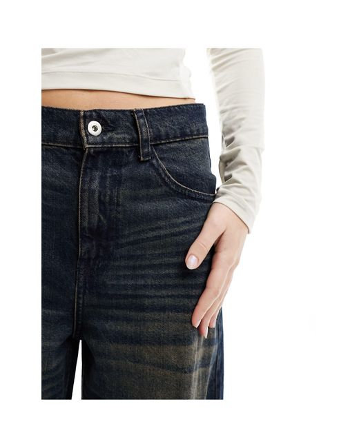 X013 - jeans a fondo ampio a vita medio alta lavaggio scuro di Collusion in Blue