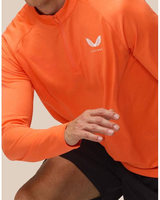 Castore Orange Adapt Training 1/4 Zip Top for men