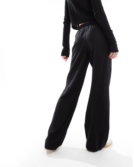 Pantalon large toucher lin Pieces en coloris Black