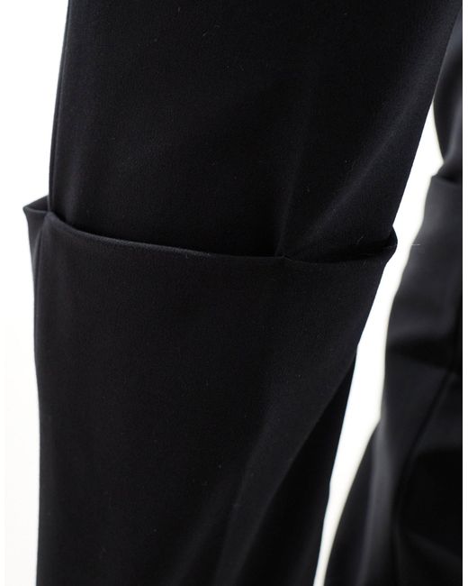 Pantaloni sartoriali slim taglio lungo neri di Mango in Black