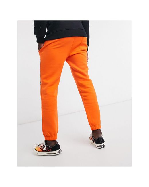 men orange joggers