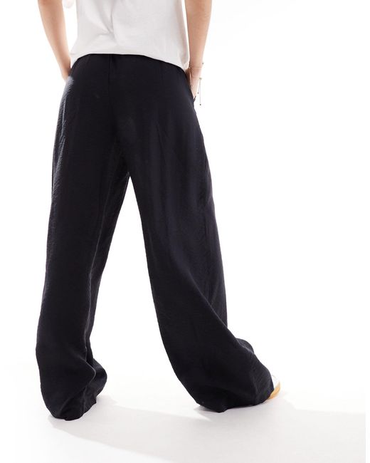 Pantaloni neri con vita alta e fondo ampio di Vero Moda in Blue