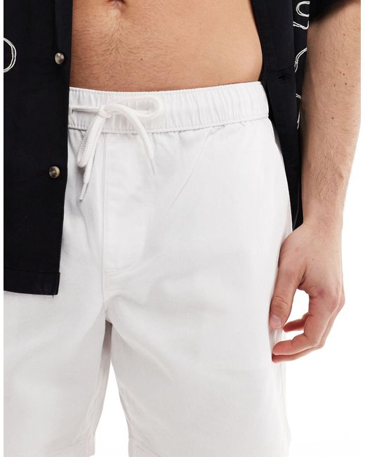 Short chino ajusté ASOS pour homme en coloris Black