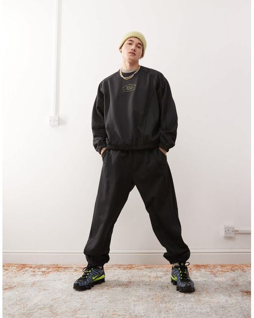 Weekday Black Oversized Sweatshirt With Fantazy Fussball Graphic Print And Contrast Seams for men