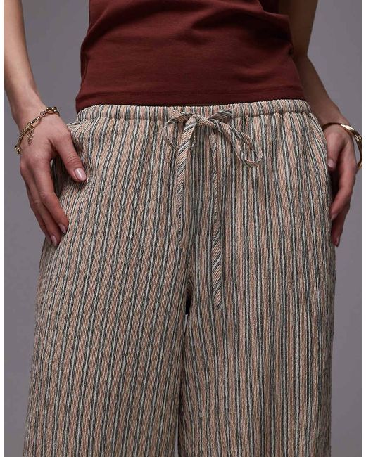 Pantaloni A Vita Bassa Con Fondo Ampio Allacciati di TOPSHOP in Brown