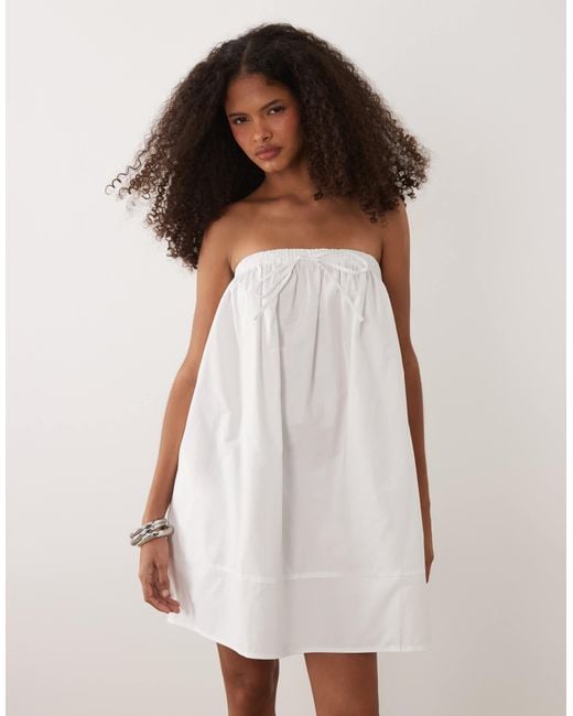 asos design pleated trapeze mini dress ASOS DESIGN Maternity pleated trapeze mini dress with tie sleeves