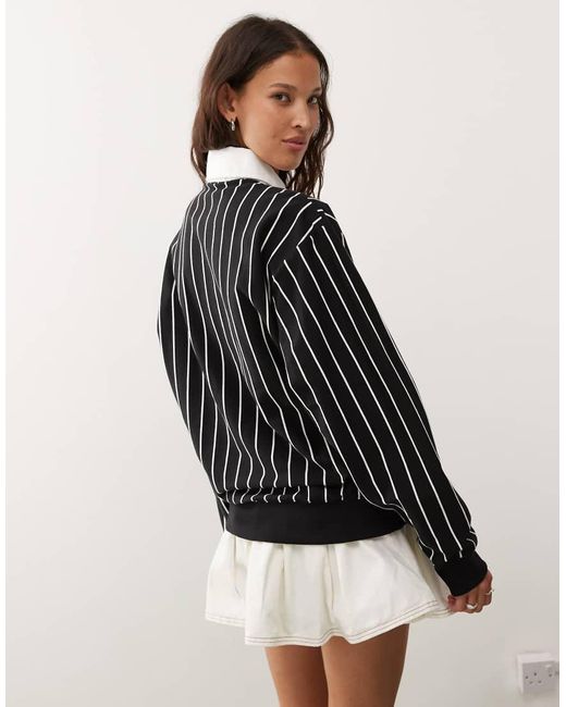 Polo Nera Gessata di Champion in Black