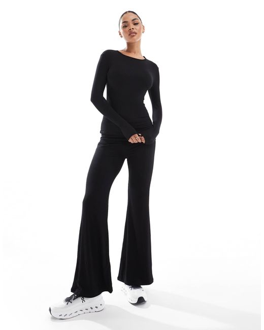 Pantalon double épaisseur évasé en jersey côtelé à taille rabattue South Beach en coloris Black