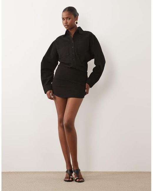 Noughts & Kisses Black Denim Pocket Front Fitted Skirt Mini Dress