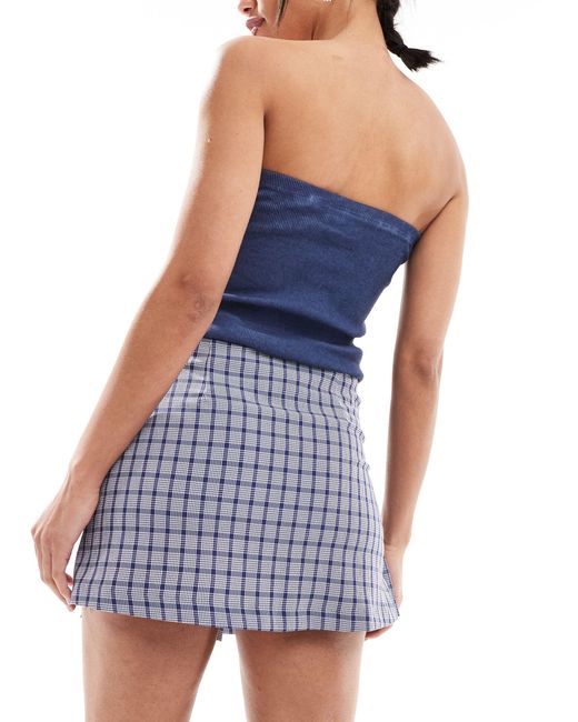 Mini-jupe portefeuille à carreaux style kilt Collusion en coloris Blue
