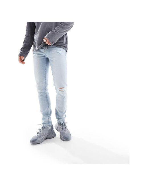 Jeans skinny azzurri sfumati con abrasioni di ASOS in White da Uomo